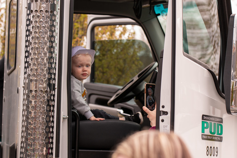Young man behind the wheel of a line truck
