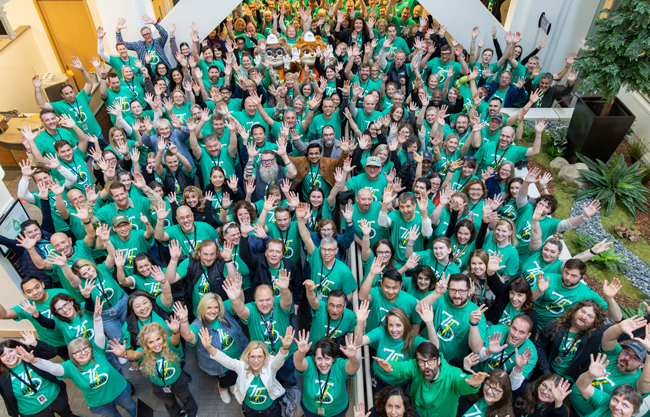 A crowd of PUD employees wearing the 75th Anniversary T-shirt