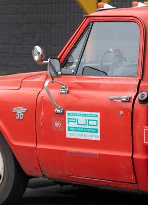 Vintage bright red truck used by the PUD in the 1960s and still in its fleet