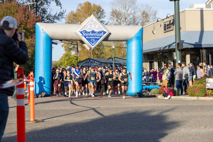 Runners surge forward out of the Run for Warmth starting gate